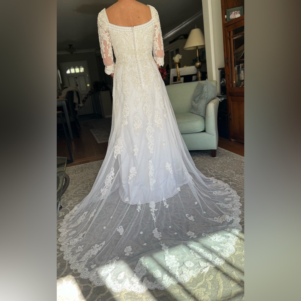 Wedding dress. Worn one and in perfect condition. Size 6.